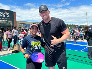 JJ Watts and pickleball coach at Dick's Sporting Goods custom pickleball courts.