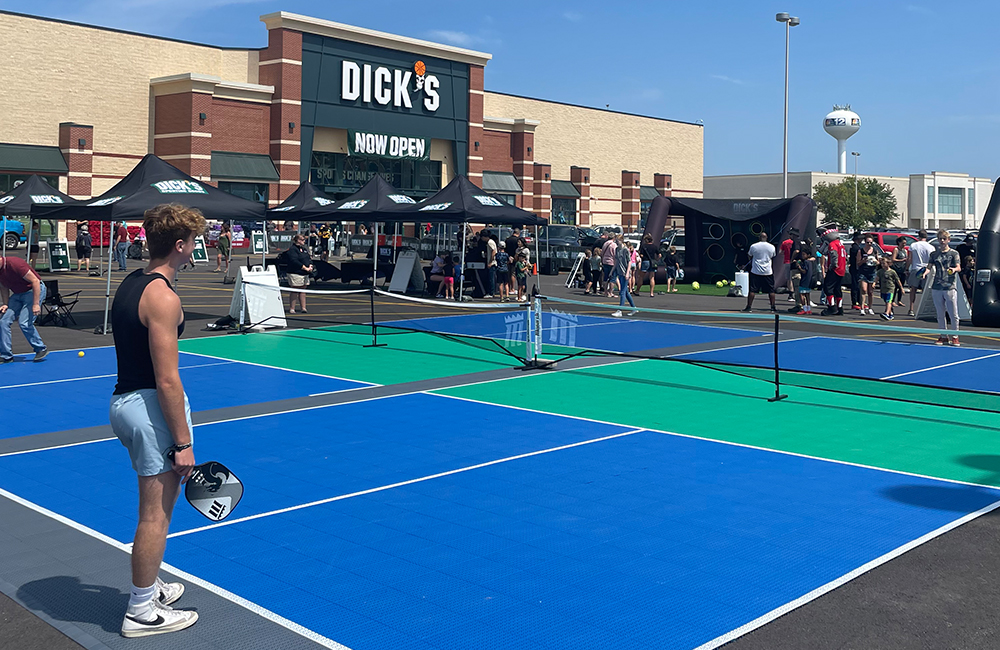 Pop up pickleball court in front of Dick's Sporting Goods.