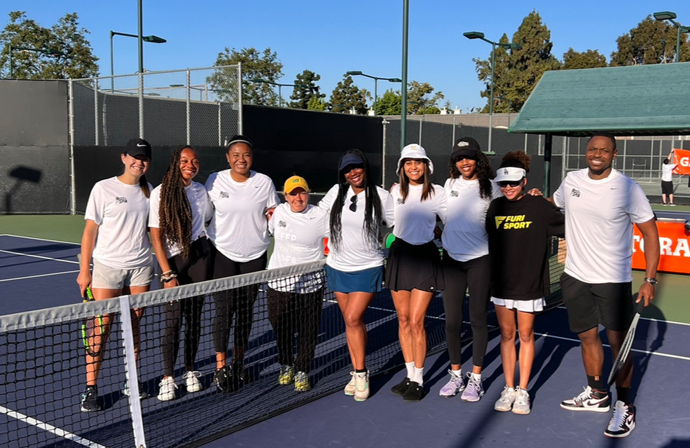 Group photo on a tennis court.